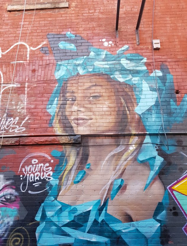 Girl in blue with Monalisa smile